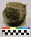 Ceramic jar, coiled, cord impressed exterior, mended, flared neck.