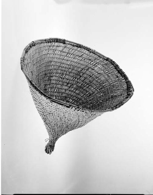 Conical carrying basket