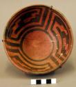 Pottery bowl - black on red, geometric design on inside