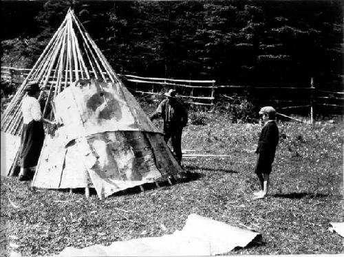 People building wigwam