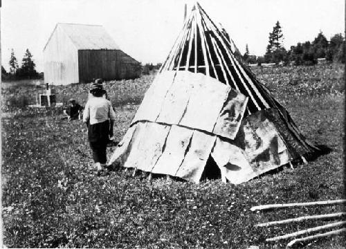 People building wigwam