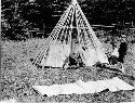 People building wigwam