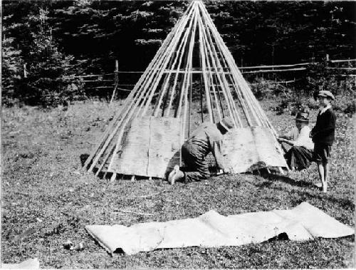 People building wigwam