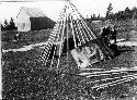 People building wigwam