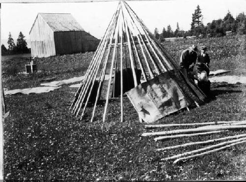 People building wigwam