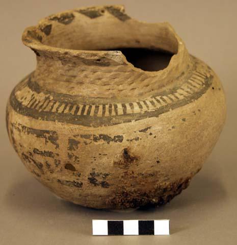 Ceramic jar, corrugated  neck and base, black on buff exterior, sherds missing