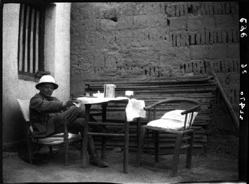 Man sits at table