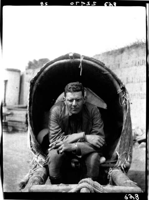 Man seated inside object