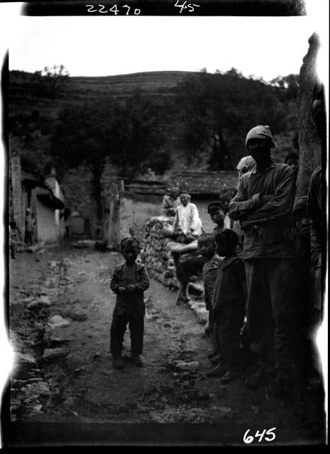 Children standing along road