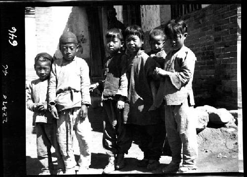 Children standing outside building