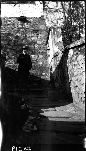 Man standing at top of steps