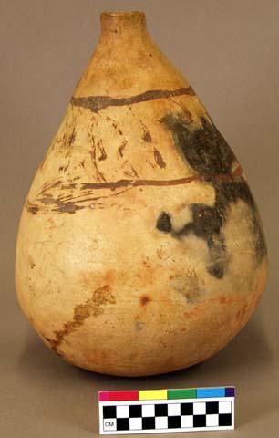 Ceramic bottle, brown on buff exterior, fireclouded