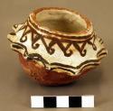 Small pottery vessel - relief points around middle, black on white