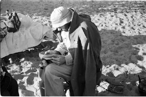 Robert Story sitting and reading a book