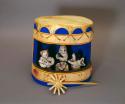 Polychrome six piece Nativity Scene (A-E) in cutout wooden Drum(F) with star (G)