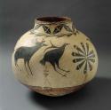 Large pottery vessel. Black bird, deer, and geometric designs on white.