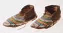 Pair of skin moccasins, decorated with beadwork