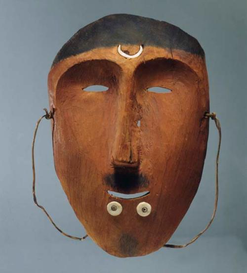 Dance mask. Male figure with ivory labrets. Crescent-shaped inlay of ivory.