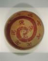 Ceramic bowl, red on buff, animal and floral design, mended