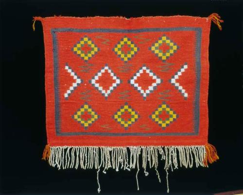 Saddle throw blanket. Germantown, red background with stepped outline diamonds