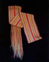 Sash, woven, with braided cord.