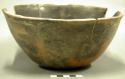 Bowl. outcurved. rounded base. body repair, rim chipped. some sherds missing. fi