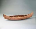 Canoe model, birch, with double curve decoration.