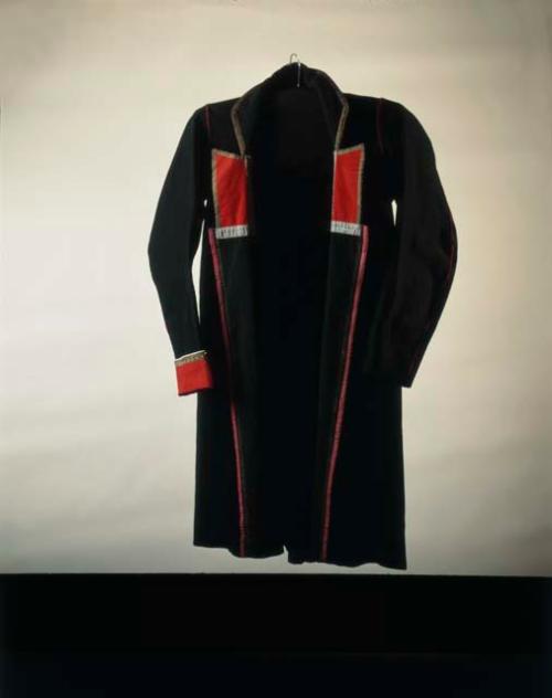 Cloth coat with several insets in back.