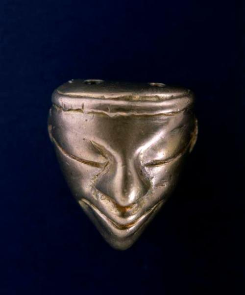 Small gold mask (human face).