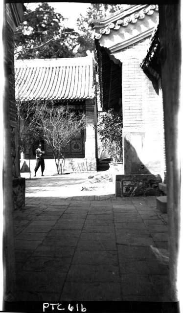 Person standing in courtyard