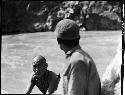 Two men along river