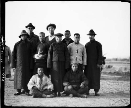 Group of men pose for photo