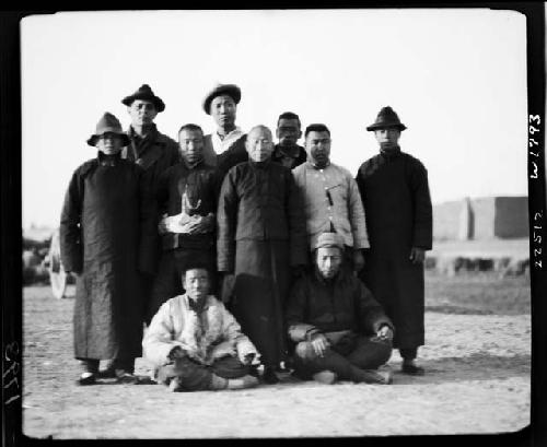 Group of men pose for photo