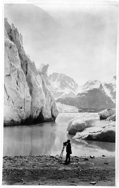 Face of Muir Glacier from Morain, with photographer in foreground