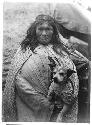 Woman holding dog