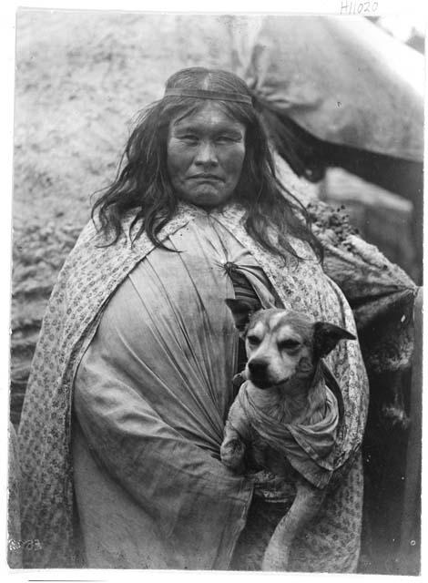 Woman holding dog