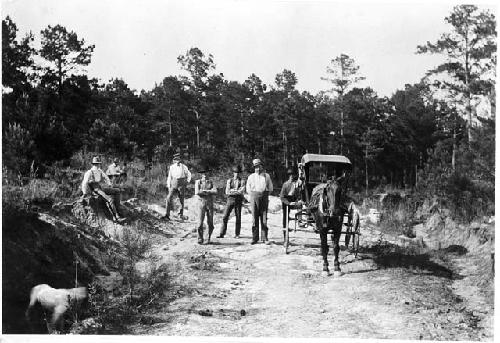 Men with buggy on road