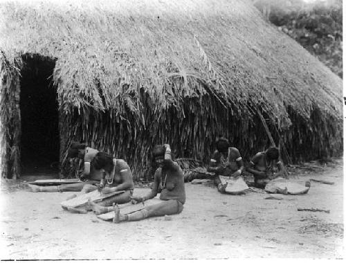 Waiwai women grating cassava
