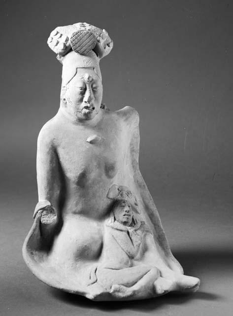 Jaina-style figurine in form of woman with small child or animal
