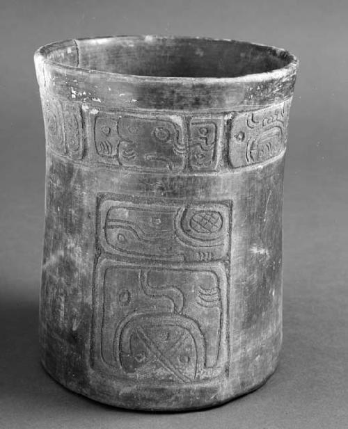 Burnished brownware vessel with incised decoration