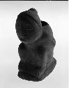 Stone effigy pipe, human, hands behind back. (86-46-10/A3889)