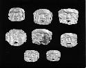 Eight miniature gold masks (10-71-20/C7691A-H)