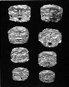 Eight miniature gold masks (10-71-20/C7691A-H)