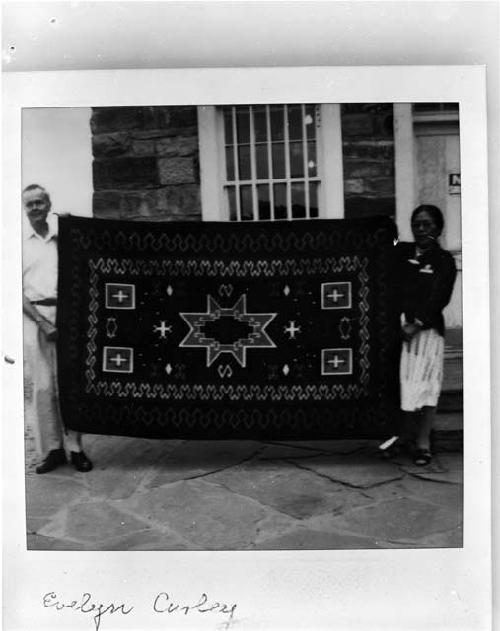 William Wright and Evelyn Curley holding her rug at Hubbell Trading Post