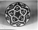 Coiled tray with animal, person, and swastika motif