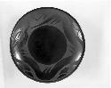 Black-on-black ceramic plate; avanyu motif