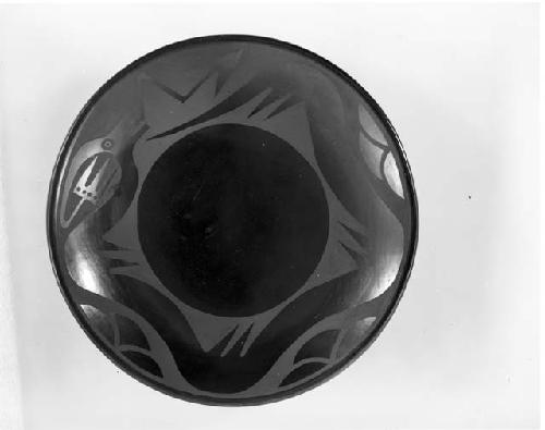 Black-on-black ceramic plate; avanyu motif