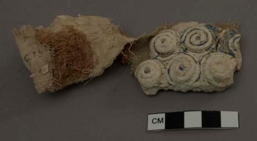 Cotton cloth with painted plaster ornaments on it - the cloth serves as a base