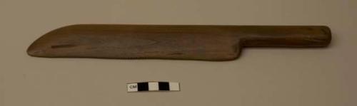 Tool, horizontal lines carved on top portion, teeth carved into blade; faintly incised "MITLA col. by E C PARSONS"