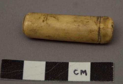 Organic utilized bone, hollow cylinder, incised rings one end